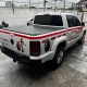 Traseira de VW Amarok Tirebot com mascote de pneus