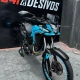 Moto trail Honda azul claro com adesivagem nas rodas