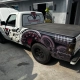 Ford Ranger branca com plotagem temática de painel automotivo