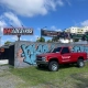 Chevrolet Silverado vermelha com adesivos Coyote Rodas
