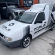 Furgão VW branco com plotagem Torus Performance